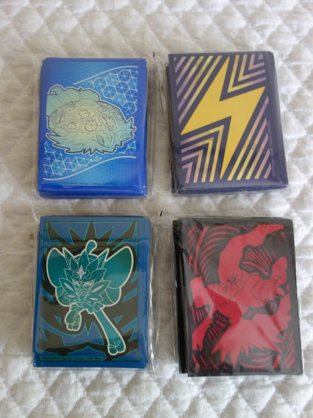 (j)	Lot of 4 NIP 65 count ea POKEMAN Trading Card Sleeves